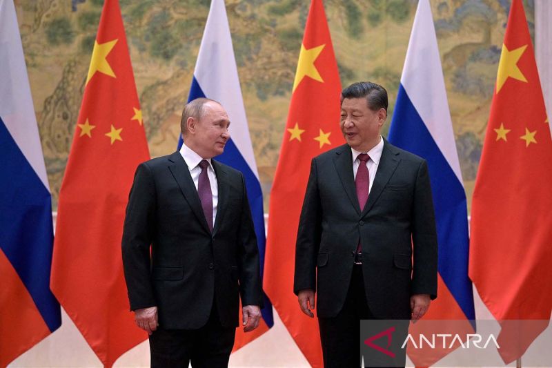 Putin dan Xi Jinping dalam pertemuan di Beijing.